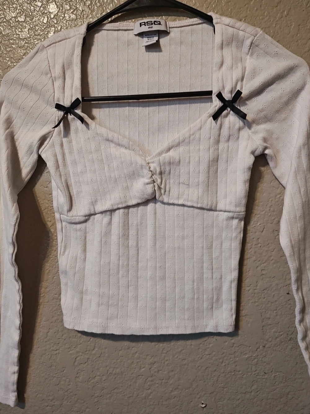 RSQ White Ribbed Long-Sleeve Babydoll Top with Black Bow Accents